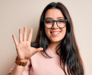 Professional woman holding up five fingers. Five reasons concept.